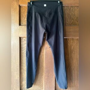 VUORI Black High-Waisted Leggings With Side Pockets.